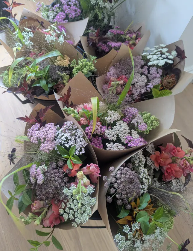 A collection of freshly wrapped seasonal bouquets