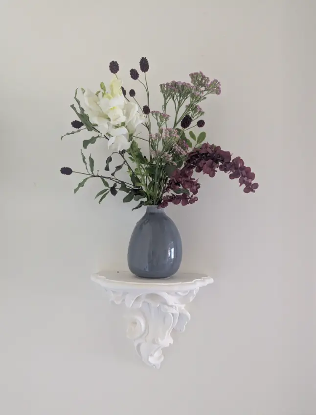 Elegant floral arrangement in a grey vase